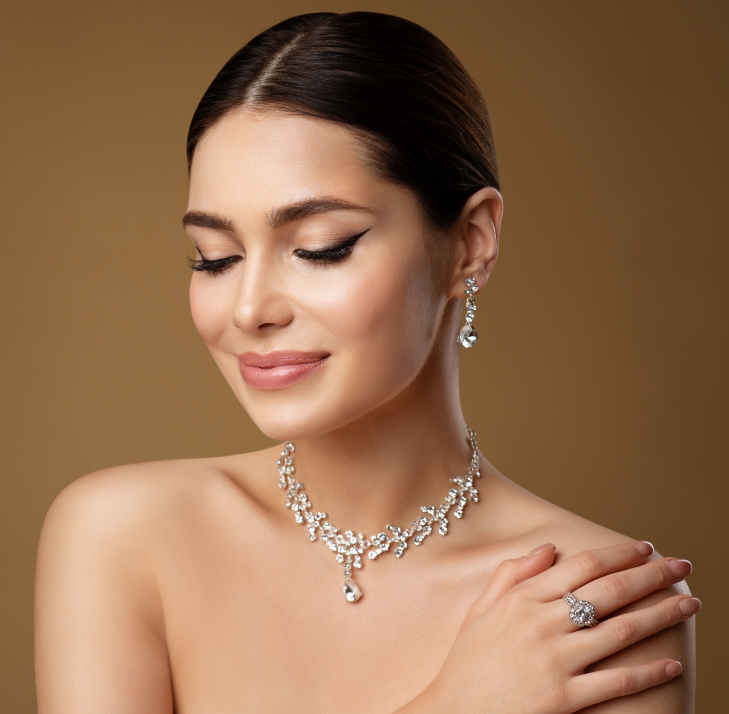 Group 1321314605 A woman wearing jewelry and looking at the camera.