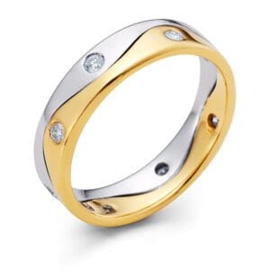 Gold and silver ring with gemstones.